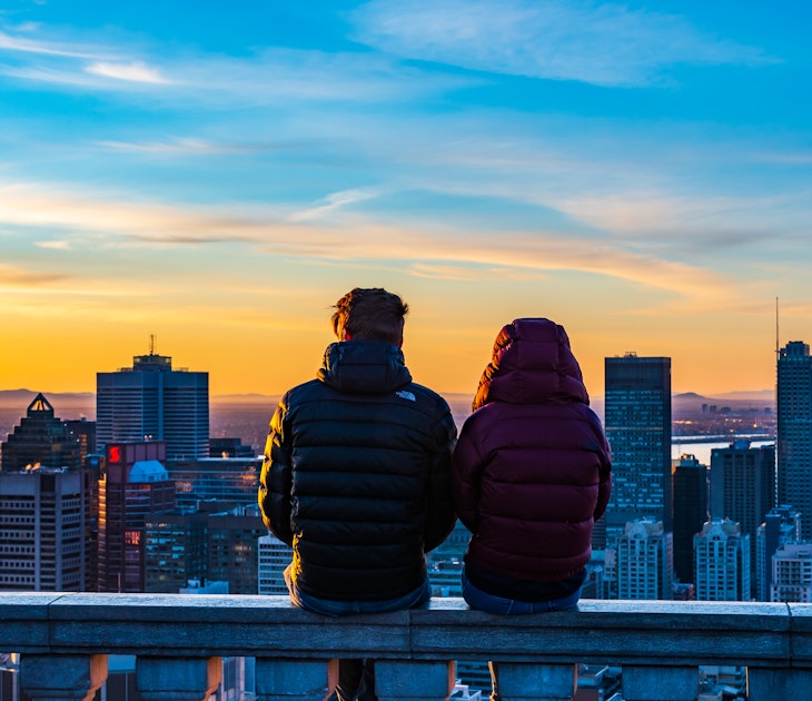 Montreal, Canada - april 2021: Back view of a couple sitting next to each other on the stone wall of the Kondiaronk belvedere and amiring the colorful view over Montreal's skyline, during sunrise; Shutterstock ID 1964403721; full: 65050; gl: Online ed; netsuite: Montreal things to do; your: Claire Naylor
1964403721