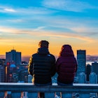 Montreal, Canada - april 2021: Back view of a couple sitting next to each other on the stone wall of the Kondiaronk belvedere and amiring the colorful view over Montreal's skyline, during sunrise; Shutterstock ID 1964403721; full: 65050; gl: Online ed; netsuite: Montreal things to do; your: Claire Naylor
1964403721