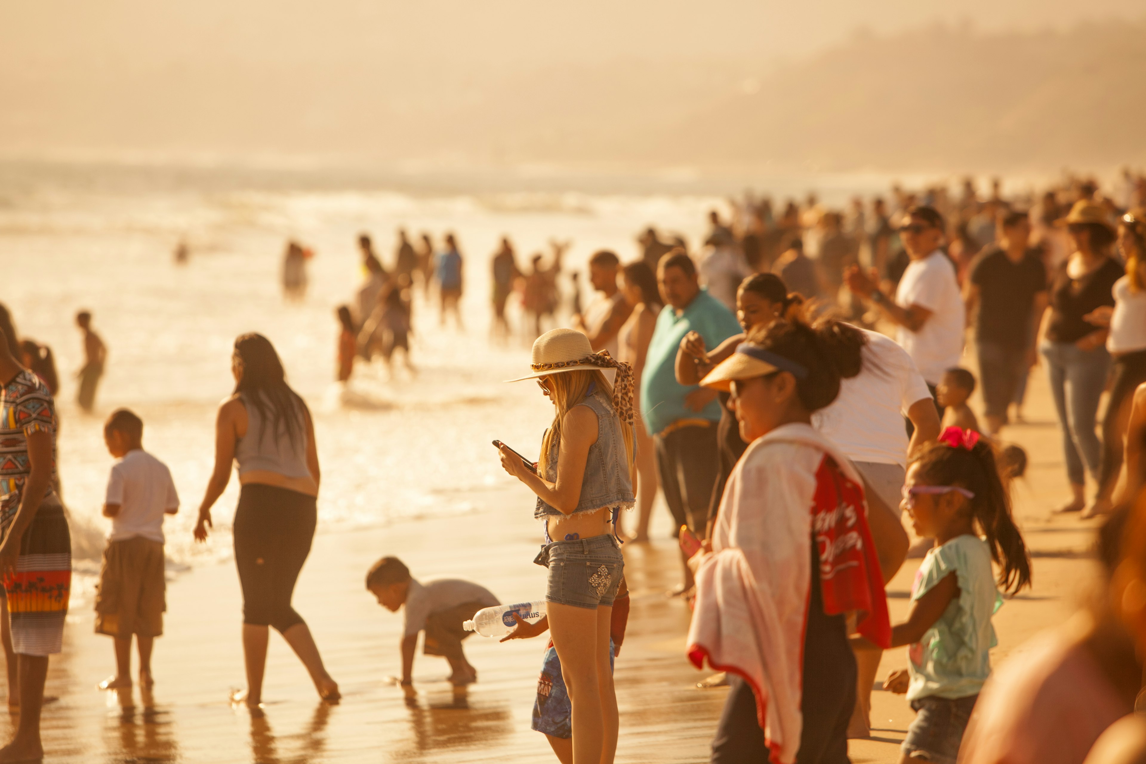 Crowds gathered to sunbathe and swim at the Santa Monica State Beach