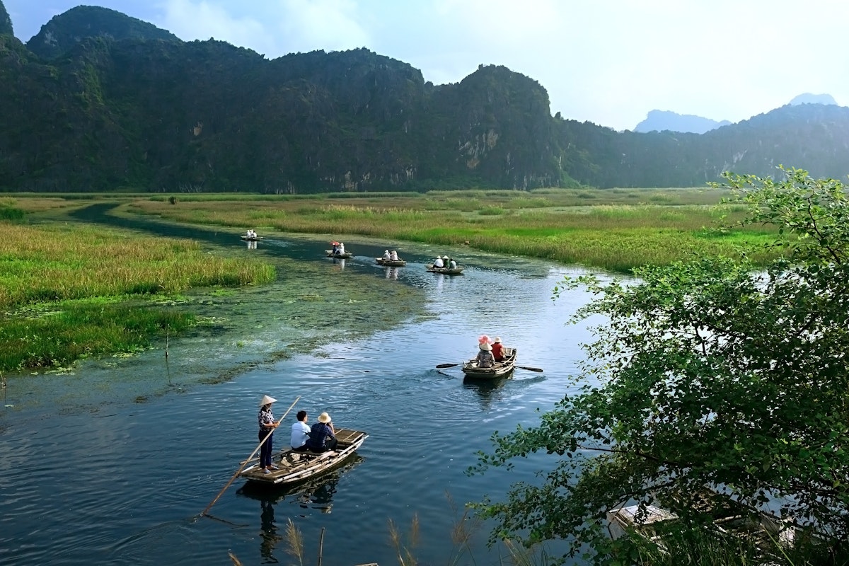 Landscape with boat in Van Long natural reserve in Ninh Binh, Vietnam.
