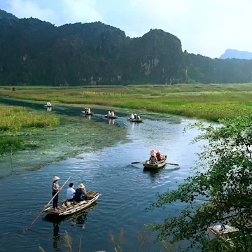 Landscape with boat in Van Long natural reserve in Ninh Binh, Vietnam.