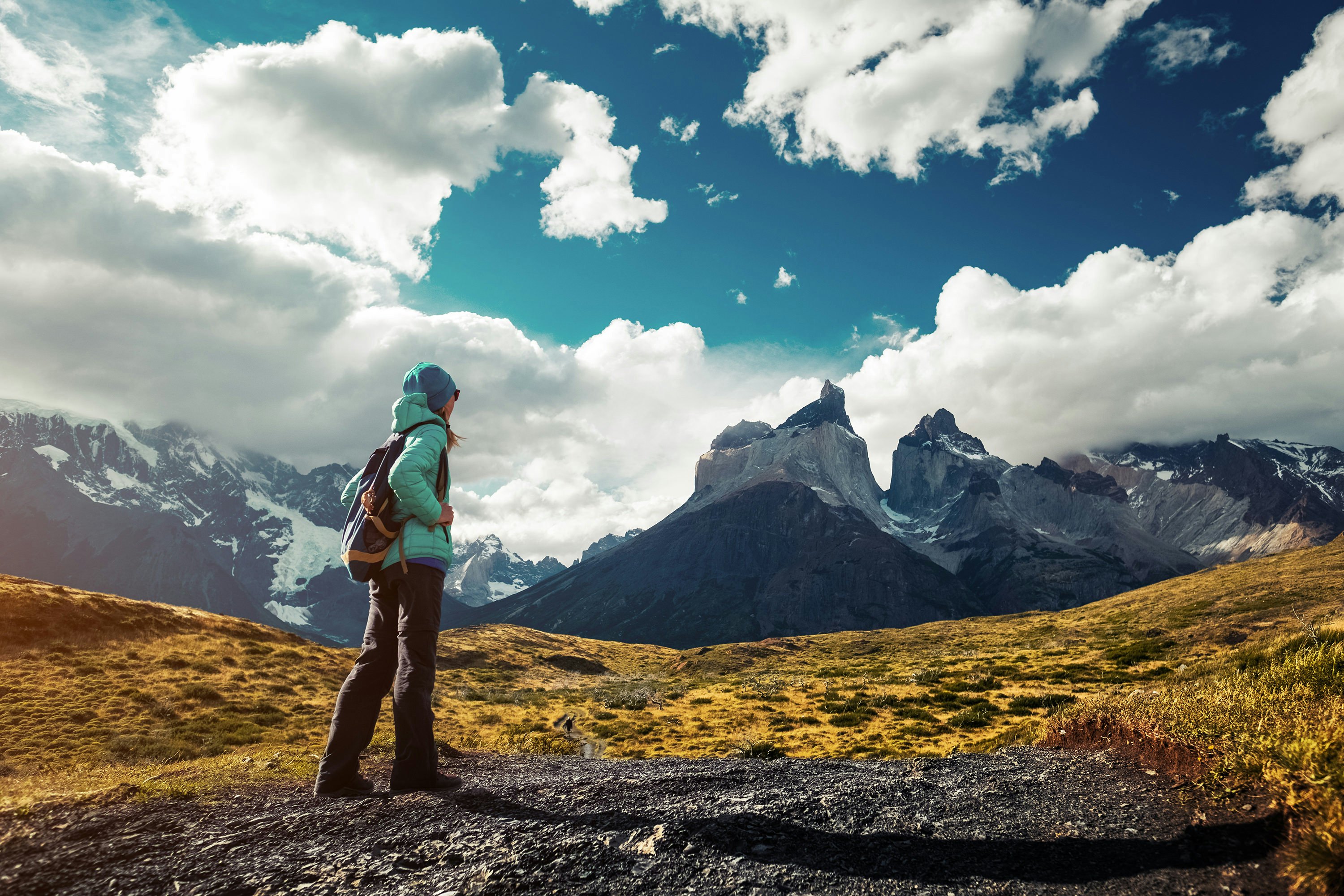 A female hiker on a trail at Torres del Paine National Park.