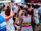 July 4, 2018: People dancing and enjoying an outdoor concert at Place des Arts in Montreal.
1312265369
audience, carnival, celebrate, celebration, cheerful, city activity, city center, colorful, crowd, culture, dance, dancing lady, dancing together, downtown, enjoying, event, fan, festival, flag, folk, folk dancer, folk dances, folk dancing, fun, gathering, group, group dancing, happiness, happy, happy face, lady in red, mont royal, montreal, montreal downtown, national day, outdoor, parade, party, people, public party, quebec, screaming, smiling, spectator, sport, stadium, street, summer, team, together