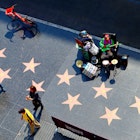 October 10, 2019: High-angle view of the Hollywood Boulevard walk of fame, as seen from the Hollywood & Highland entertainment center Dolby Theatre rooftop terrace.
1559045450
actor, actress, america, avenue, blvd, boulevard, building, california, cars, celebrity, cinema, city, county, dolby theatre, downtown, entertainment, fame, famous, film, glamour, highland, hollywood, landmark, los angeles, media, movie, music, oscar, outside, pedestrians, place, producer, shops, singer, star, starline, street, strip, sunset, theater, theatre, tile, tourism, tourist, traffic, urban, usa, view, walk, walk of fame