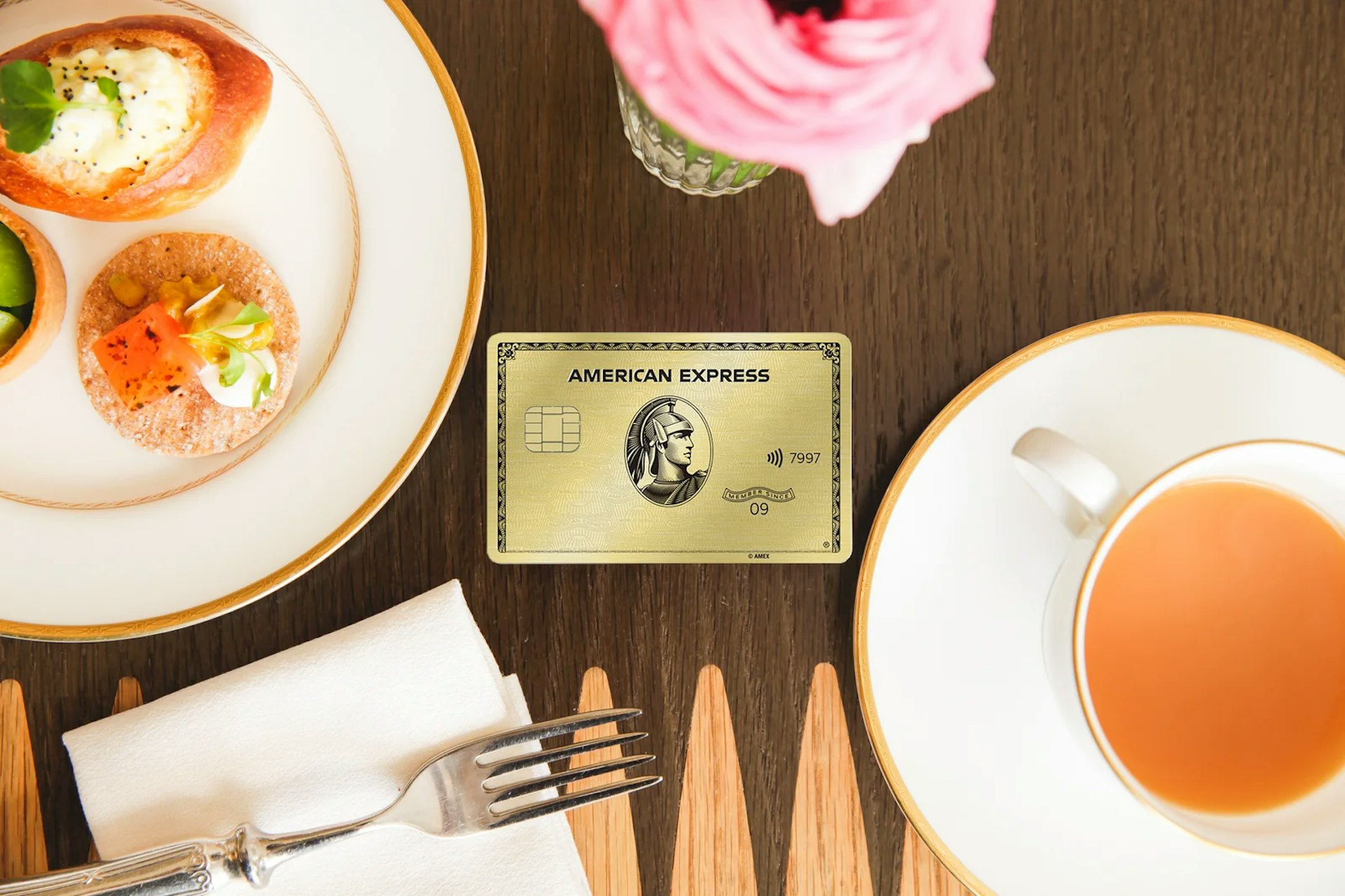 A photo of the American Express Gold Card on a dining table
