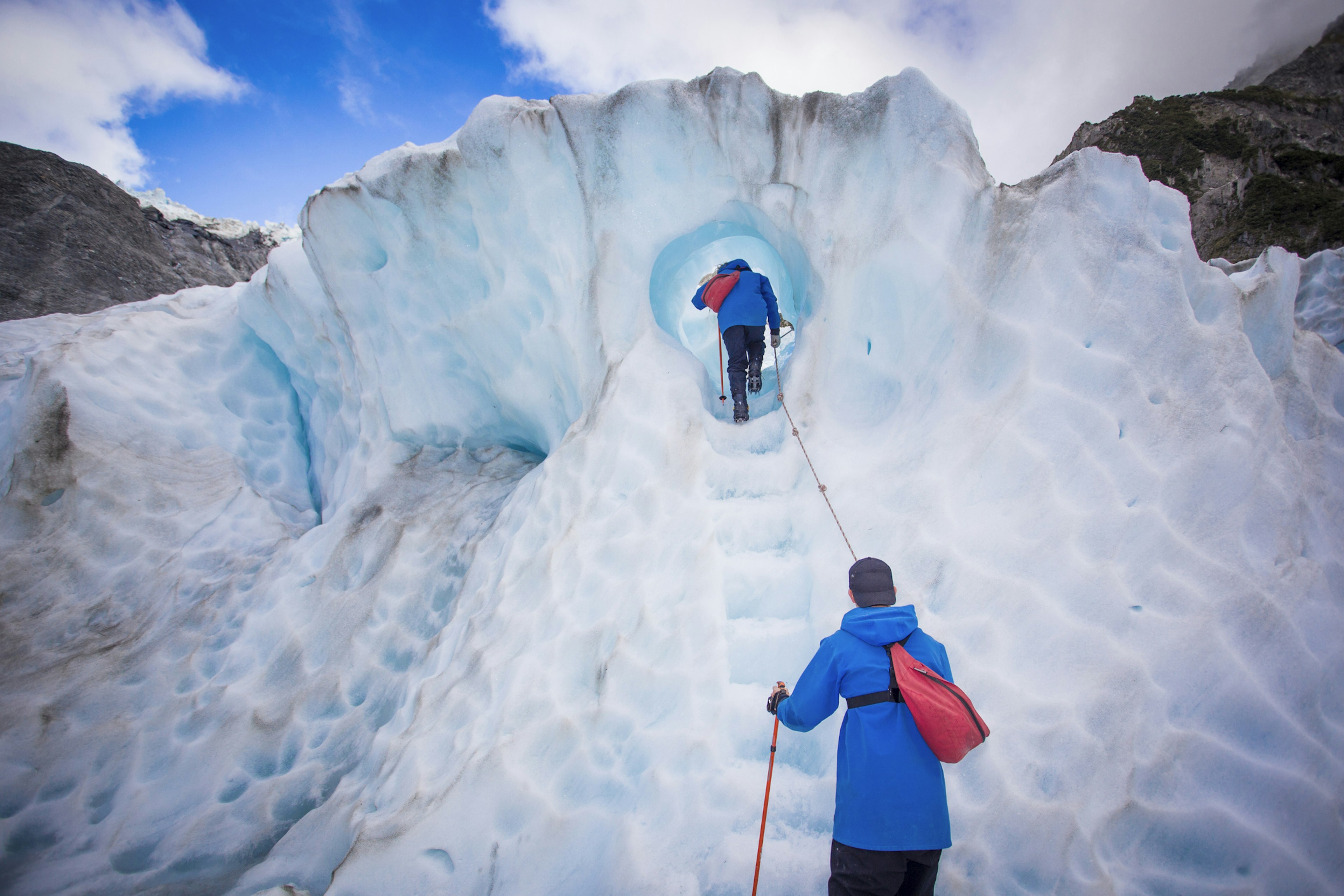 Hikers explore a glacier