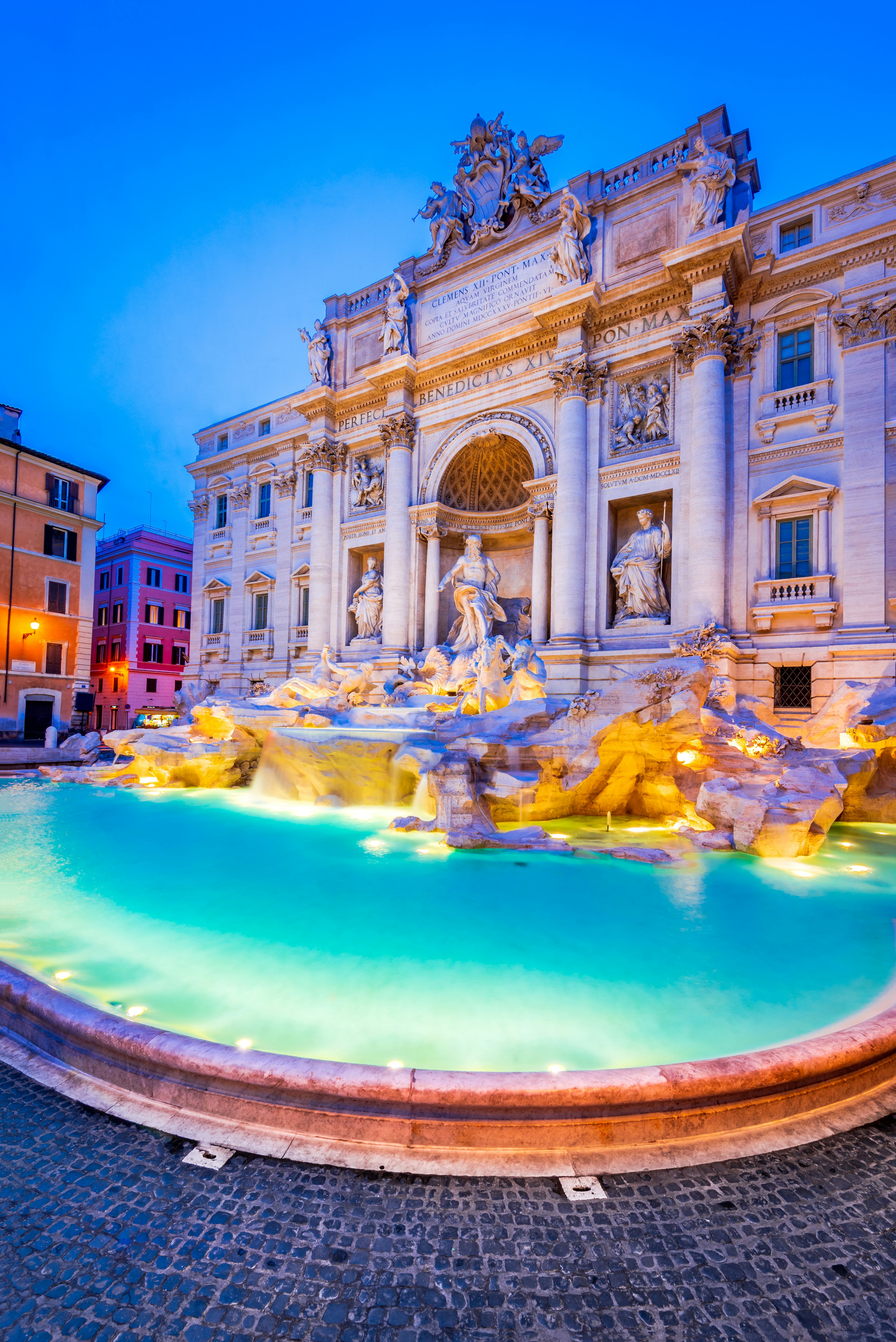 Trevi Fountain illuminated at night; Rome, Italy