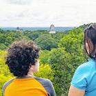 Rear view of curly hair boy and his mother in front of landscape in Tikal: rainforest and mayan pyramids. .The Tikal National Park in Guatemala protects a large tropical forest of 576 km2, in it is the largest archaeological site in America: Tikal (which means "Place of Voices") and is one of the largest Mayan cities known today with more than 3,000 archaeological elements. It was declared a World Cultural and Natural World Heritage Site in 1979.
1148504527
temple i