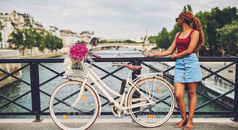 Shot of a young woman touring the city of Paris with a bicycle
1180138804