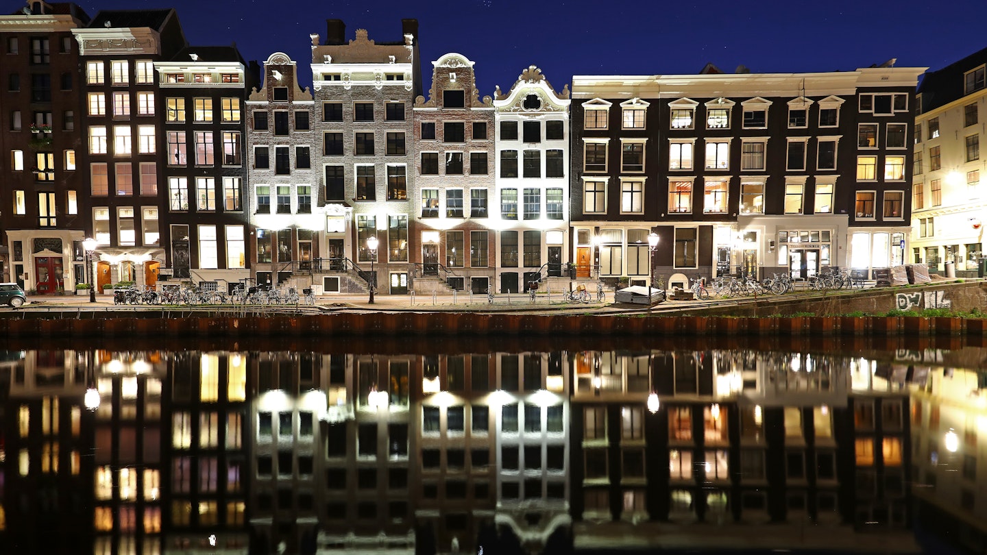 AMSTERDAM, NETHERLANDS - APRIL 04: A general view of houses near the "Red Light District" which comes from the red neon lights that highlight the windows where prostitution is legal, but the area is also famous for its canals, coffeeshops selling marijuana or cannabis, brothels, sex shops and museums on what would be a usually busy Saturday night on April 04, 2020 in Amsterdam, Netherlands. All non-essential businesses will follow national policy regarding the coronavirus (COVID-19) due to precautionary measures and will be closed to the public at least until further notice. The Coronavirus (COVID-19) pandemic has spread to many countries across the world, claiming over 60,000 lives and infecting hundreds of thousands more. (Photo by Dean Mouhtaropoulos/Getty Images)
1217135211
bestof, topix