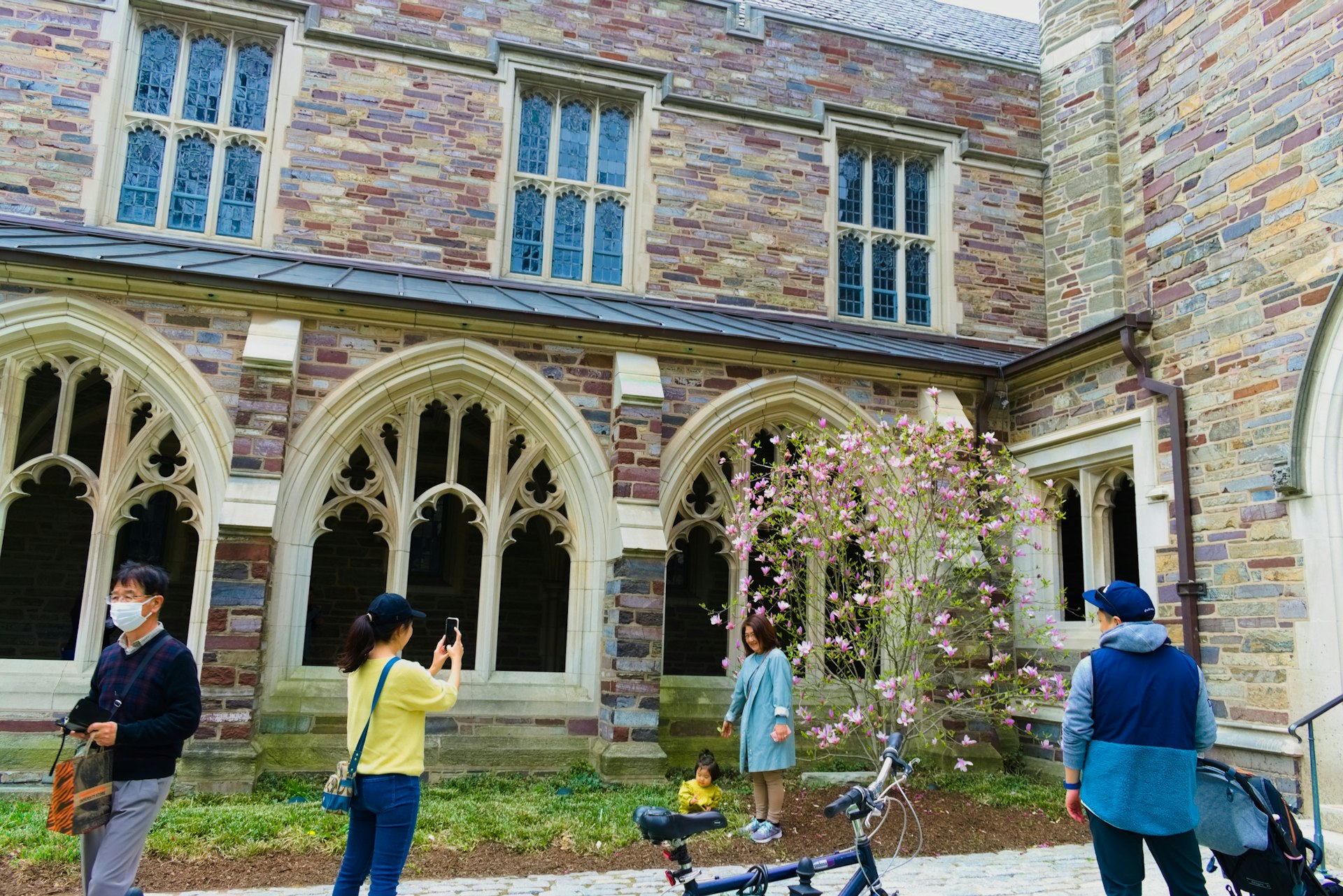 Tourists take photos at one of the Princeton university campus building exterior