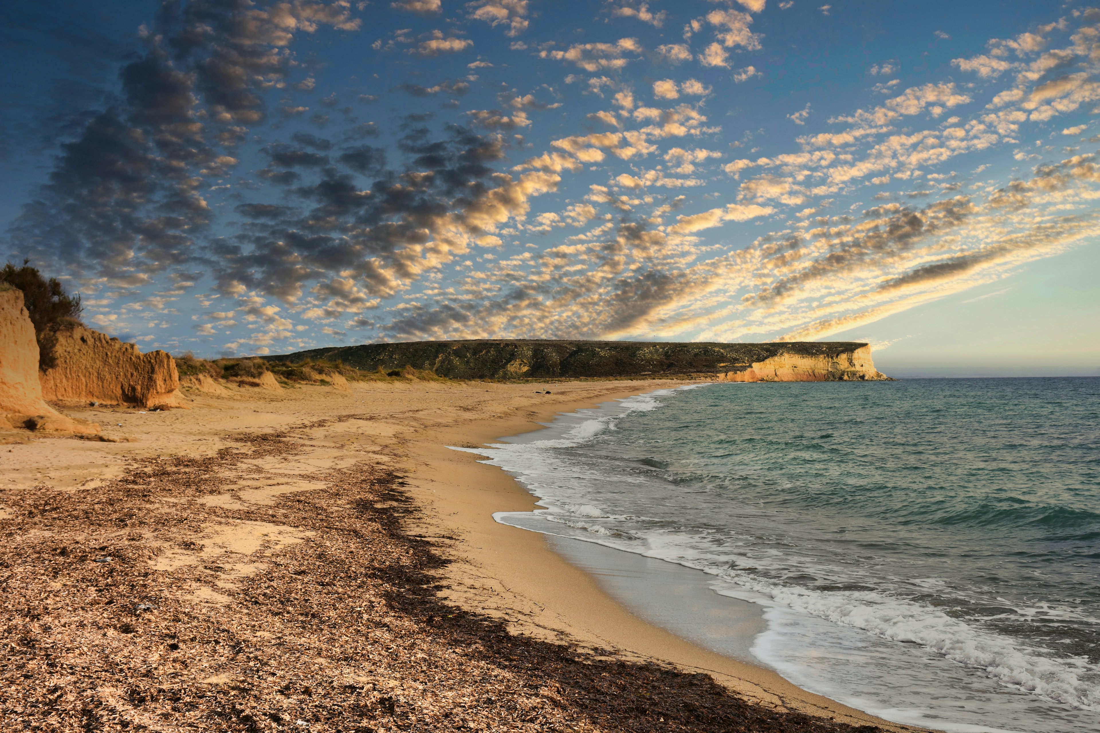 An empty Kefalos beach at sunset