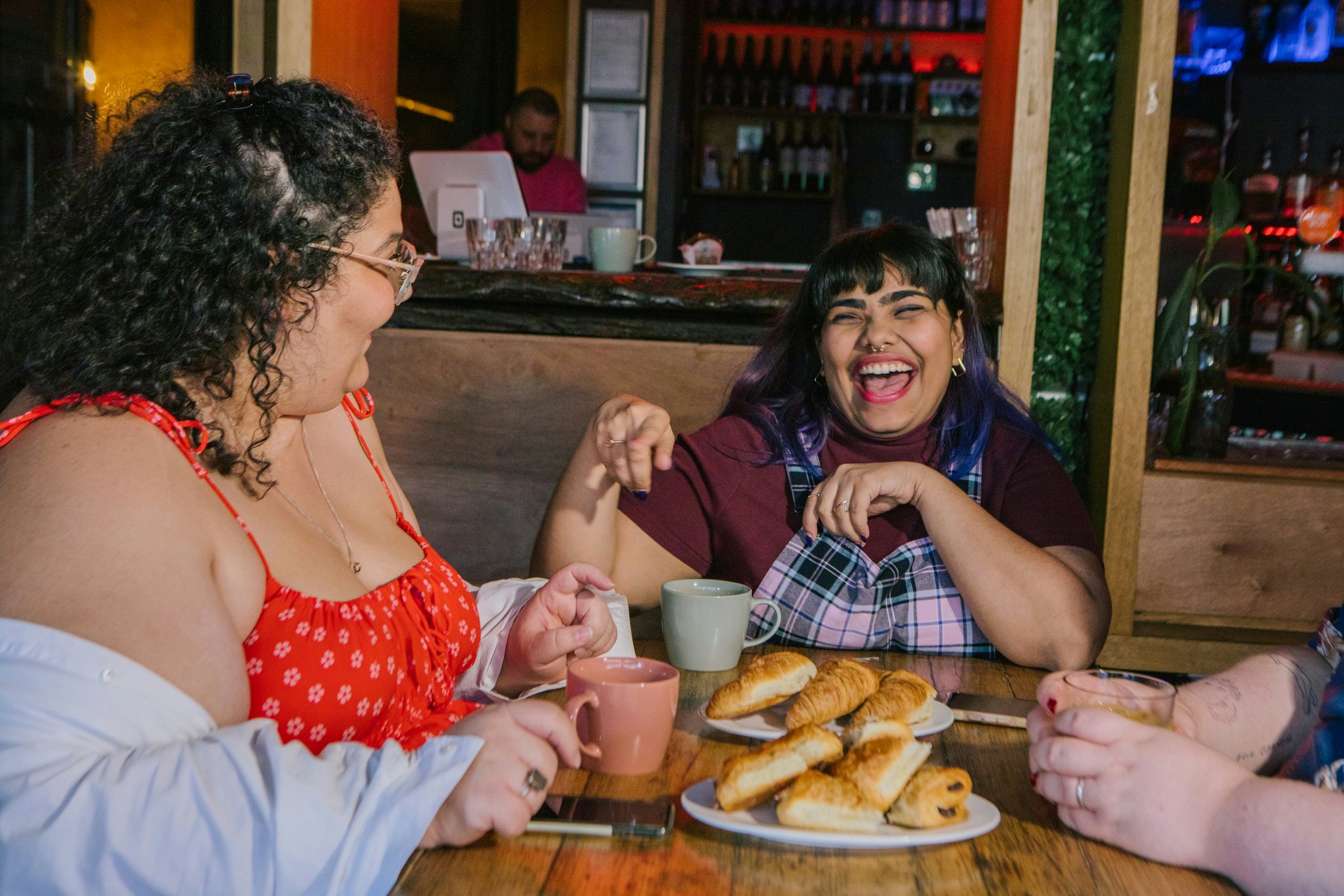 Friends meet up in a cafe in Melbourne, Australia.