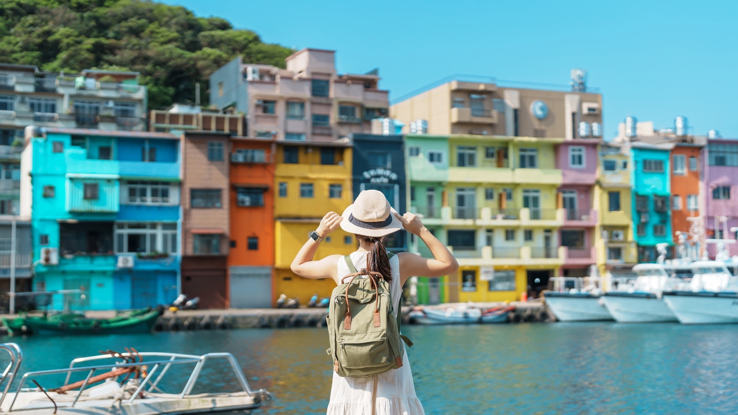 woman traveler visiting in Taiwan, Tourist with backpack and hat sightseeing in Keelung, Colorful Zhengbin Fishing Port, landmark and popular attractions near Taipei city . Asia Travel concept
1480972323
heping