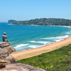 Man at the edge of cliff staring the views over Palm Beach in Sydney, New South Wales, Australia - January, 2019
1483122199