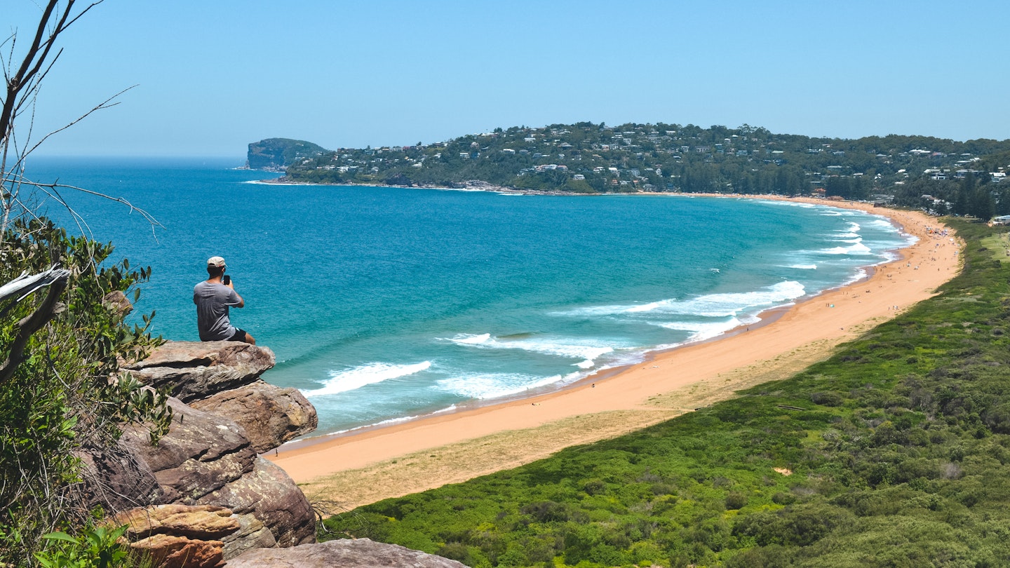 Man at the edge of cliff staring the views over Palm Beach in Sydney, New South Wales, Australia - January, 2019
1483122199