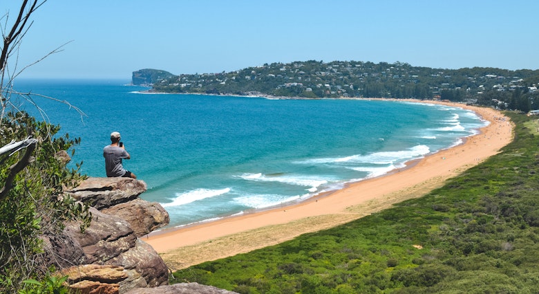 Man at the edge of cliff staring the views over Palm Beach in Sydney, New South Wales, Australia - January, 2019
1483122199