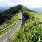 151645207
Car driving along country mountain road.