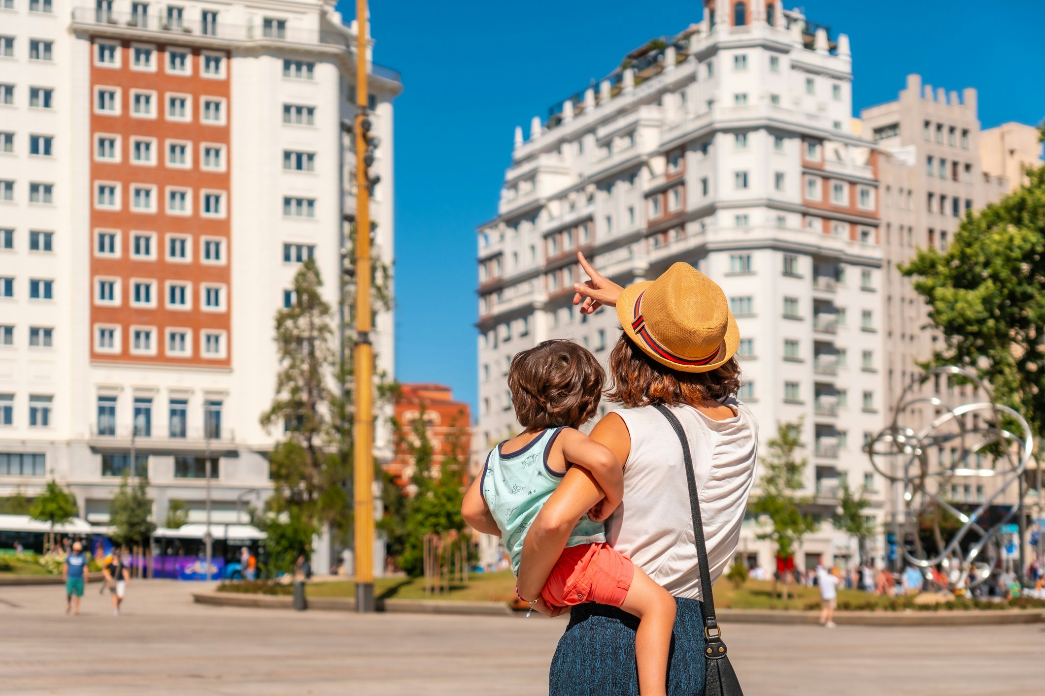 Mother with her son sightseeing in the center of Madrid