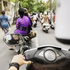 This over the shoulder royalty free, stock photograph is from a motorbike rear passenger point of view. An 18 year old Indonesian woman is driving the vehicle. Her helmet is out of focus in the foreground providing copy space. The road ahead in Ubud, Bali is full of other motor scooters and pedestrians wearing colorful, traditional Balinese clothing during late afternoon rush hour. Photographed with a Nikon D800 DSLR camera.
469663856
Balinese Culture, Real People, Sports Helmet, Over The Shoulder View, Photography, Moped, Personal Perspective, City Life, East Asian Culture, Ubud, Rush Hour, Motor Scooter, Color Image, 18-19 Years, Driving, Traffic, Asian Ethnicity, Asian and Indian Ethnicities, Routine, Cultures, Crowded, Full, Travel Destinations, Transportation, Lifestyles, Urban Scene, Outdoors, Horizontal, Bali, Indonesia, Asia, Day, Street, Road, City, Motorcycle, Land Vehicle, Mode of Transport, Common