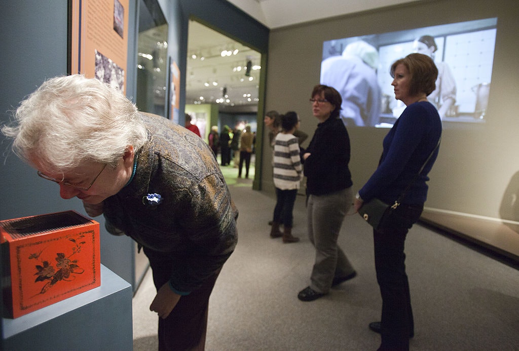 Visitors view an original exhibition,