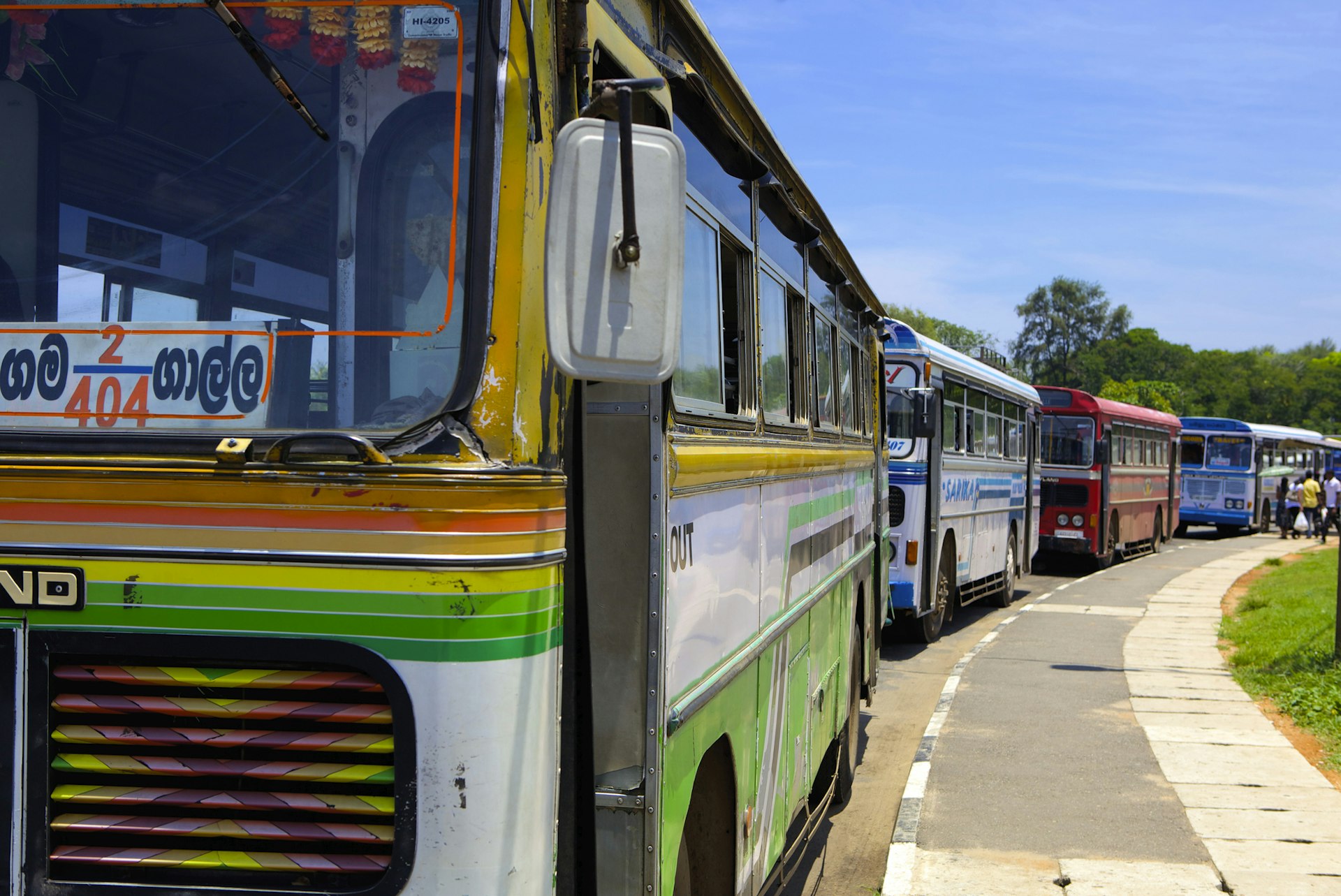 Colorful buses parked in a line