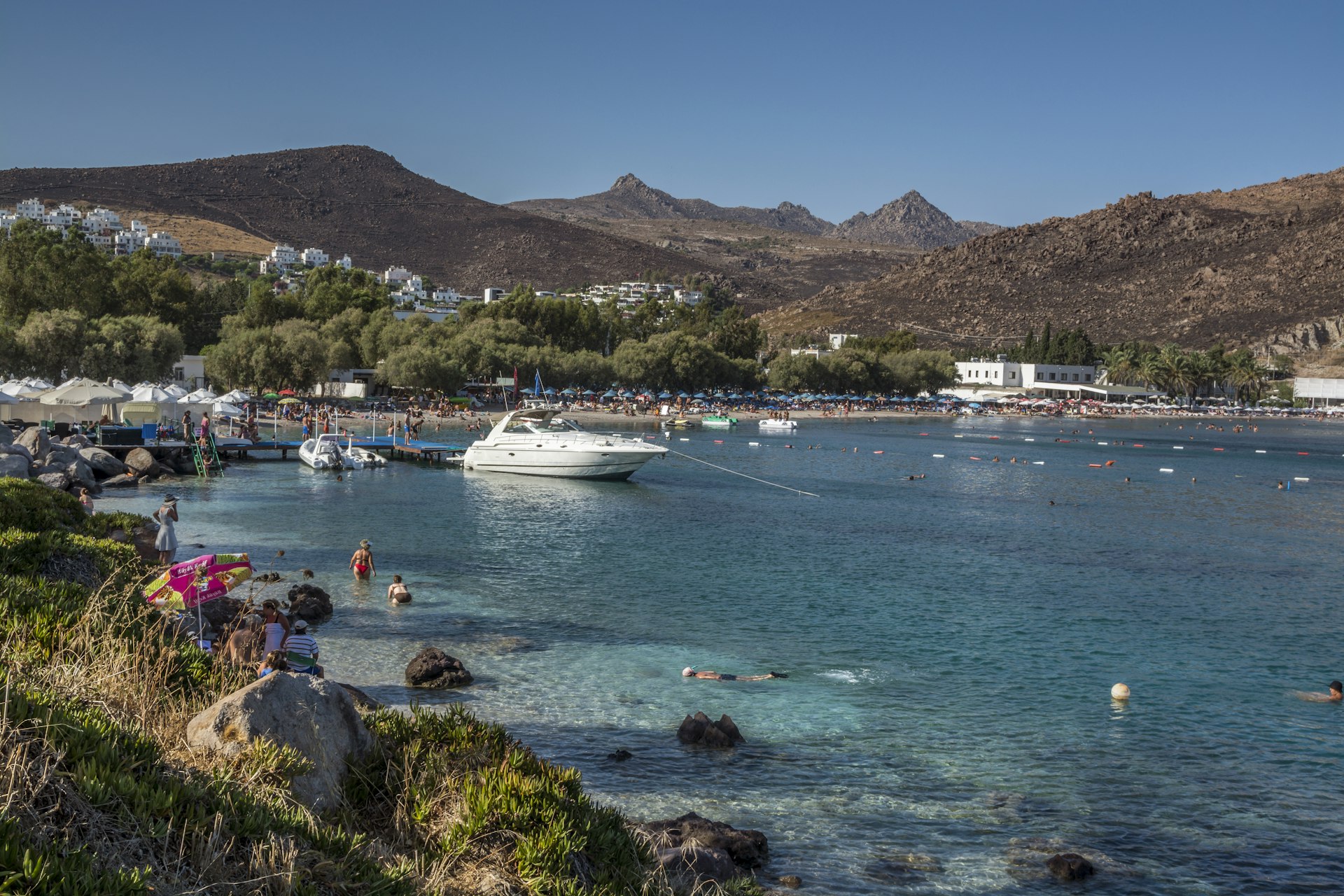 A harbour in Bodrum filled with sea-splashing holidaymakers and boats