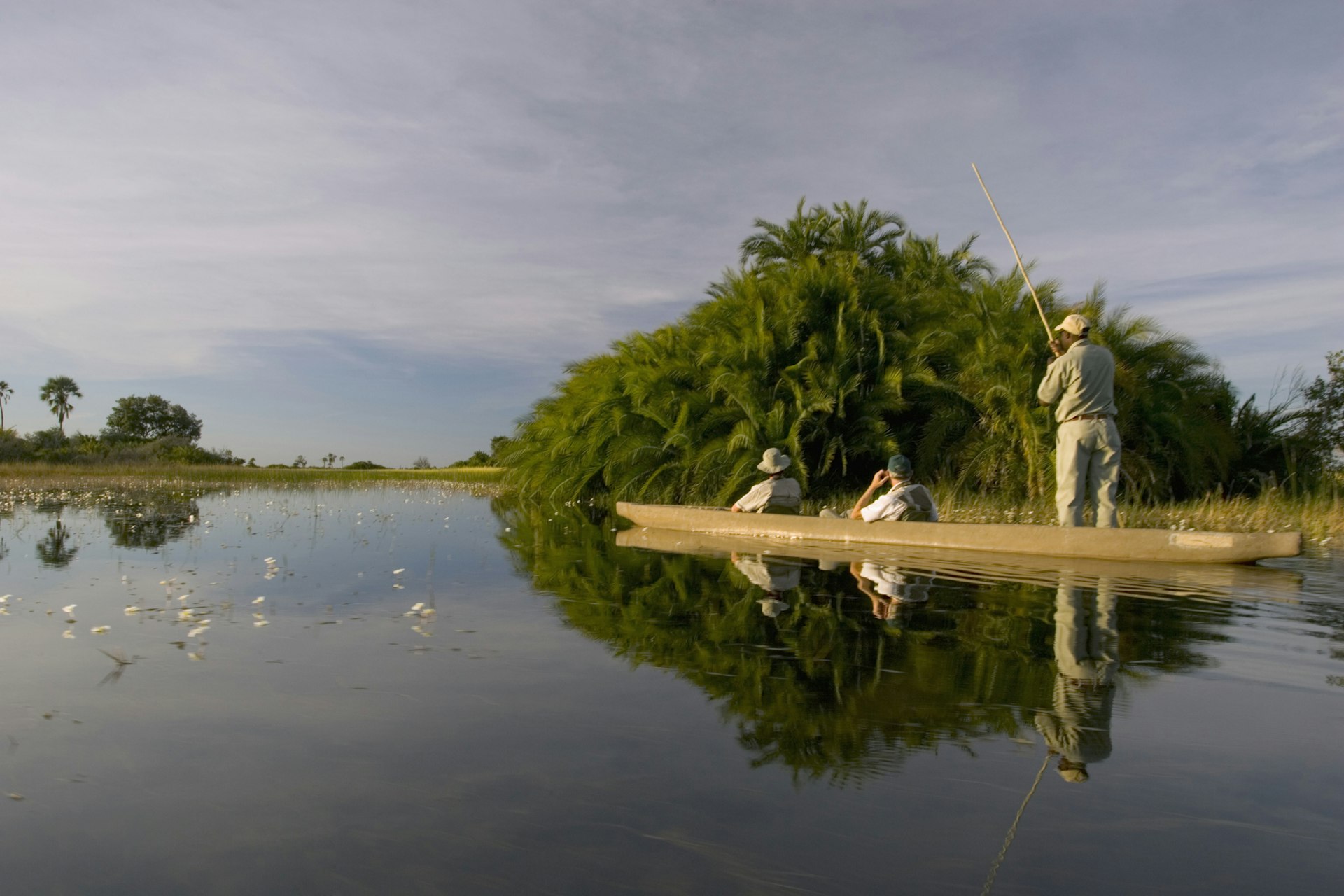 A mokoro (traditional canoe) tour through the waters of the Okavango Delta in Botswana