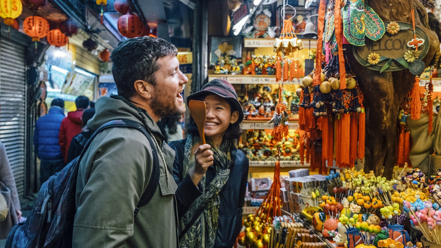 A woman and man shopping together in a Taipei market