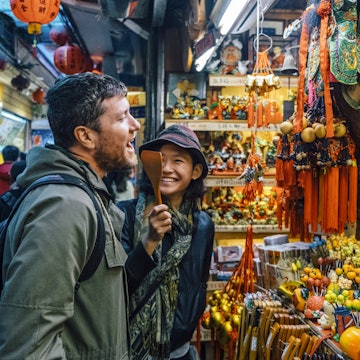 A woman and man shopping together in a Taipei market