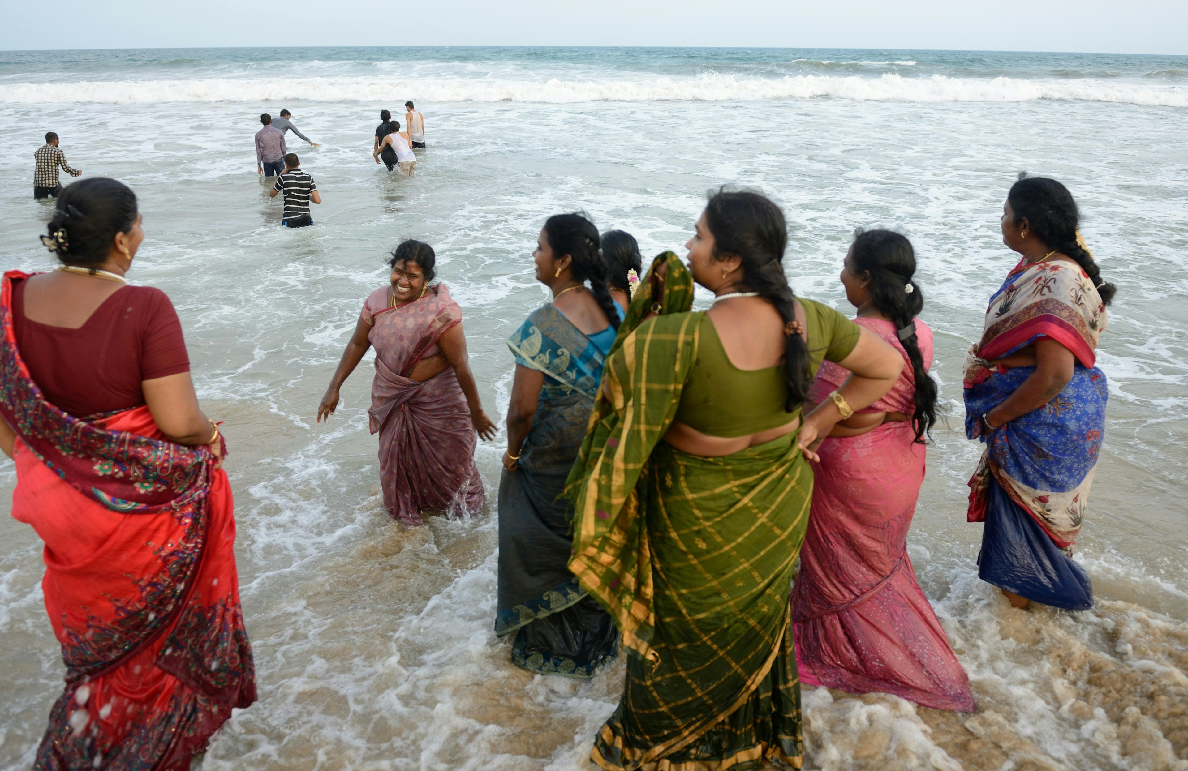 Women in the water at the beach of Mahabalipuram, Tamil Nadu, India