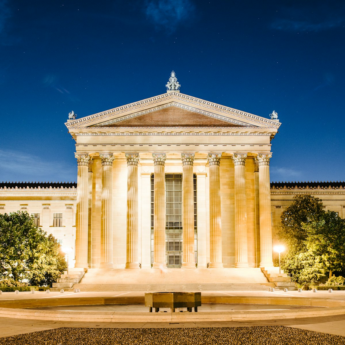 Exterior of the Philadelphia Art Museum entrance at night.
181142415
Square, Clear Sky, Architectural Feature, Philadelphia Museum of Art, Night, Dusk, Travel locations, Sky, Art Museum, Star - Space, Building Exterior, Museum, Famous Place, Architectural Column, Architecture, Philadelphia - Pennsylvania, Outdoors, No People, Photography, Star, Pennsylvania, Philadelphia, North America, Greek Culture, Neo-Classical, Column, Built Structure, USA