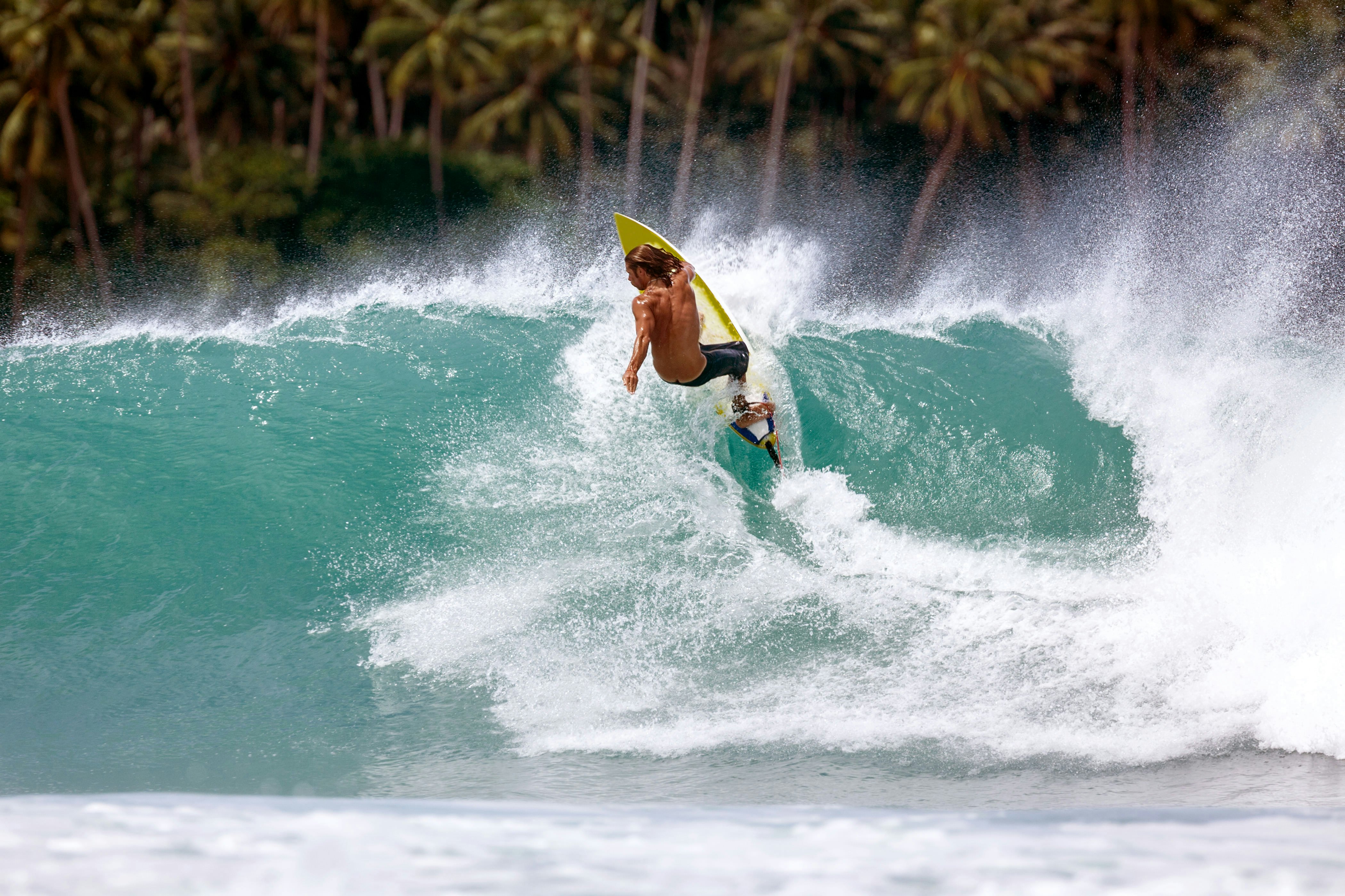 Indonesia, North Sumatra, Nias, surfing at Lagundri Bay.