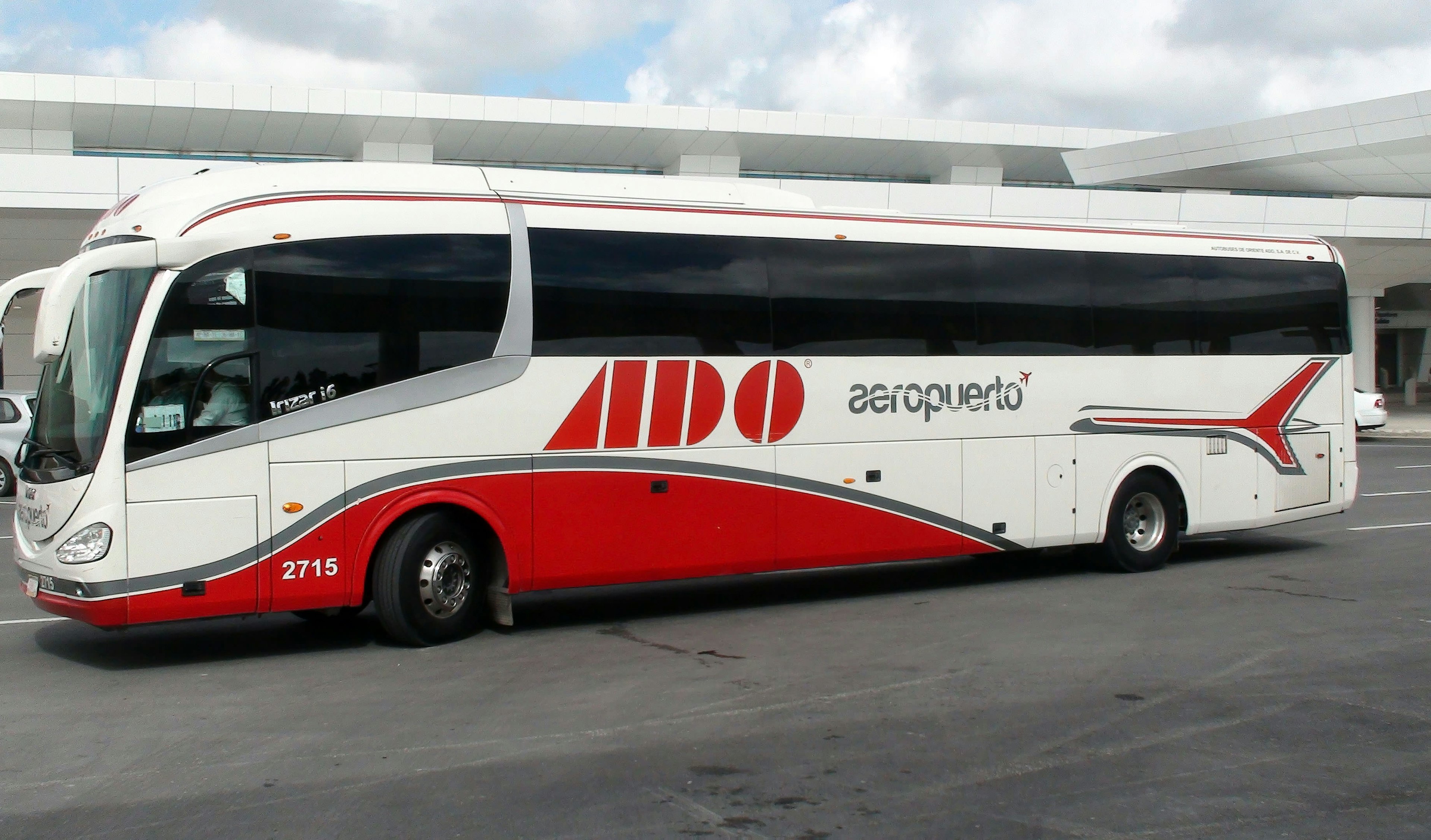 ADO Airport Bus parked at Cancun Airport.