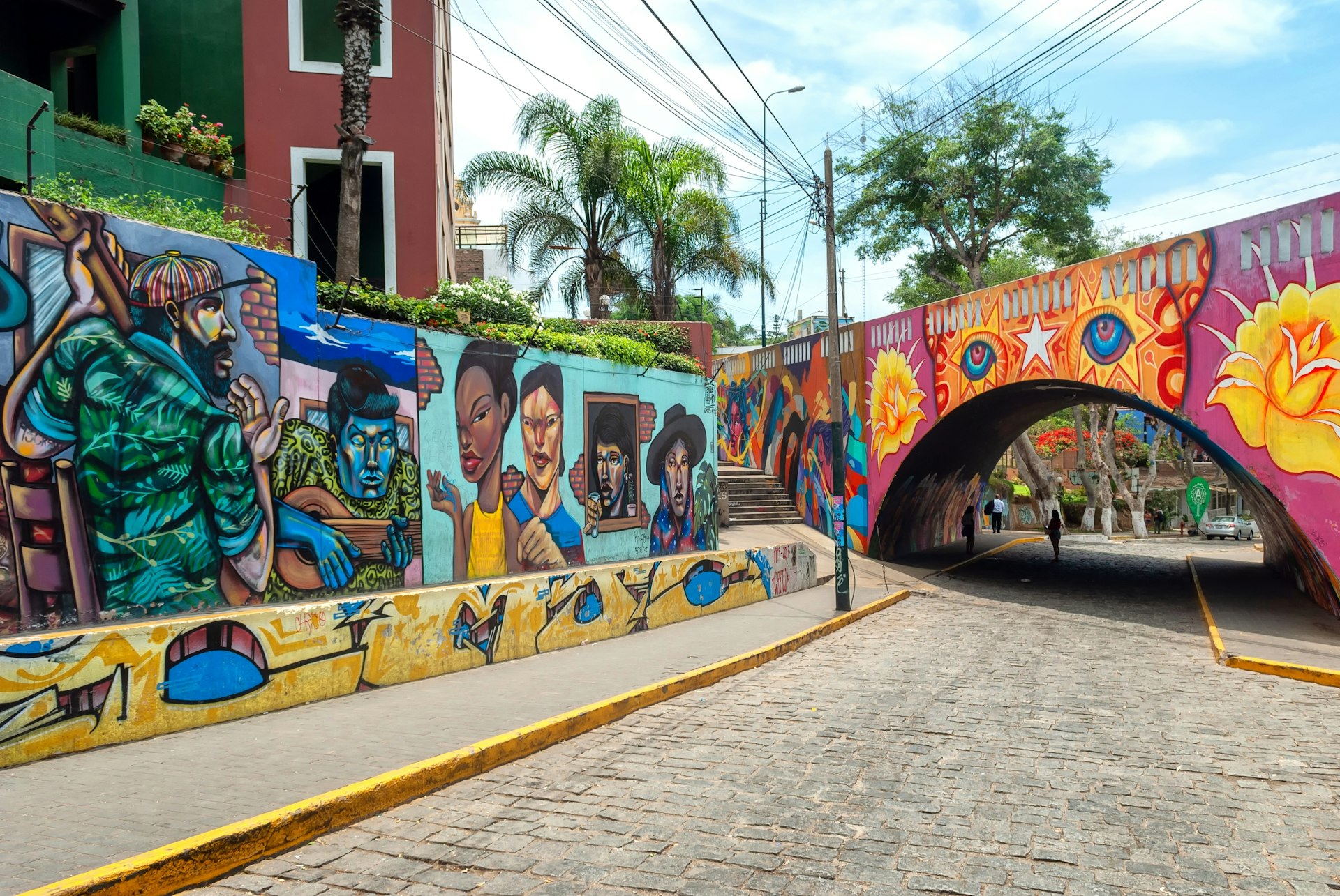 Street scene of colourful, street art on the walls and tunnel in the hip district of Barranco, Lima