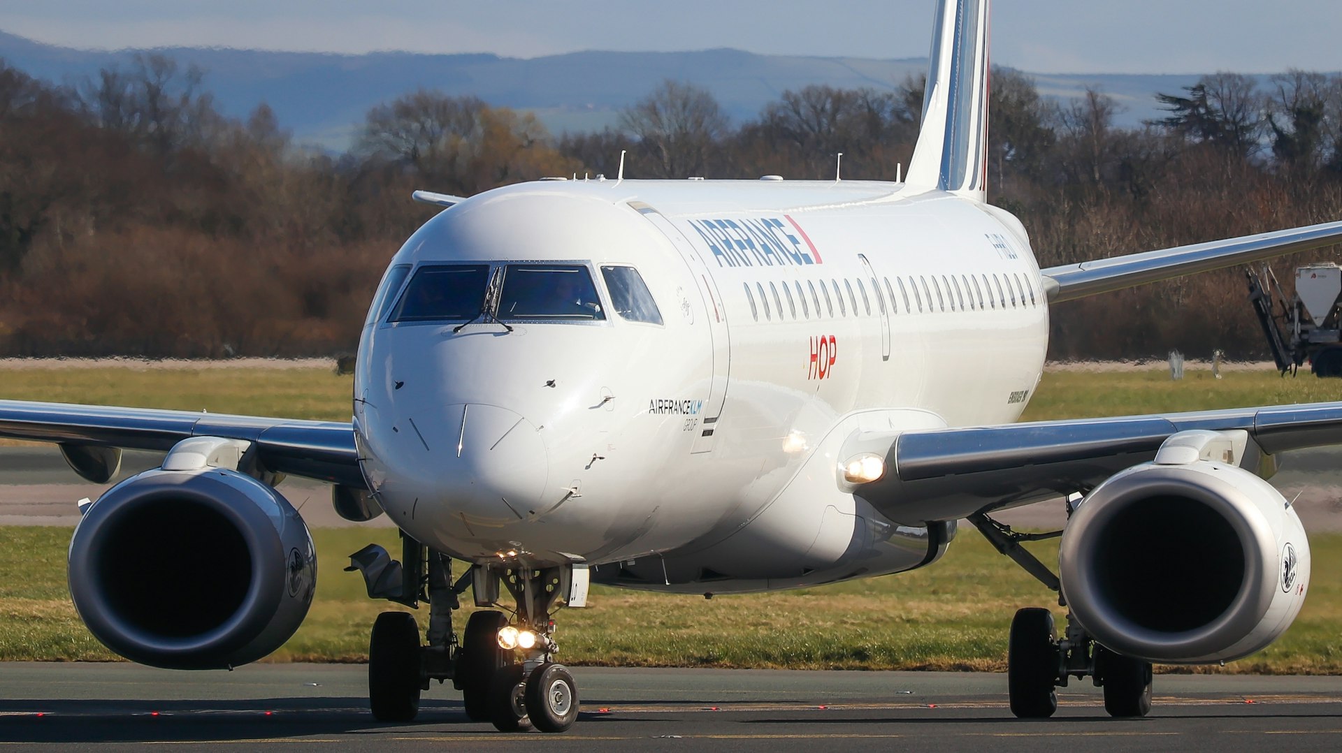 An Air France Embraer 170 taxiing on the runway