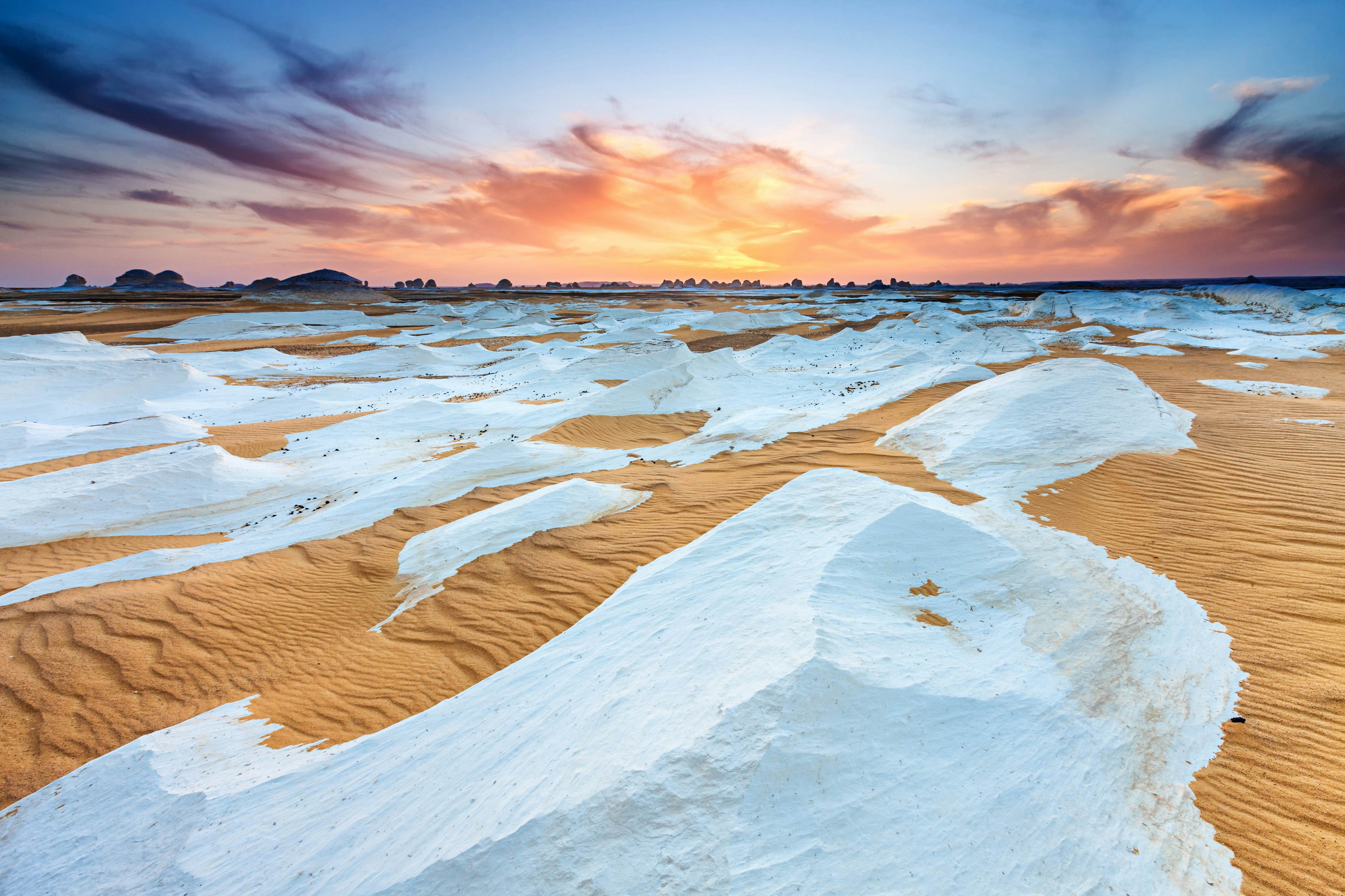 "Sunset over  The White Desert, part of The Western Sahara Desert in Egypt. The White Desert of Egypt is located 45 km (28 mi) north of the town of Farafra. The desert has a white, cream color and has massive chalk rock formations that have been created as a result of occasional sandstorm in the area."
175454221
"Horizon Over Land, Africa, Arid Climate, Awe, Beauty In Nature, Chalk, Cloud, Cloudscape, Desert, Dramatic Sky, Dry, Dusk, Egypt, Environment, Extreme Terrain, Geological Feature", Heat, Horizon, Idyllic, Land, Land Feature, Landscape, Landscapes, Large, Light, Majestic, Moody Sky, National Park, Natural Land State, Natural Phenomenon, Nature, Nature, Nature Reserve, Nobody, Non-Urban Scene, Parkland, Remote, Rippled, Rock, Romantic Sky, Sahara Desert, Sand, Sand Dune, Saturated Color, Scenics, Shade, Shadow, Sky, Solitude, Sun, Sunbeam, Sunlight, Sunset, Twilight, Vibrant Color, Western Sahara Desert, White Desert