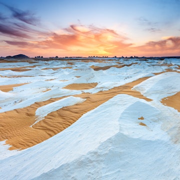 "Sunset over  The White Desert, part of The Western Sahara Desert in Egypt. The White Desert of Egypt is located 45 km (28 mi) north of the town of Farafra. The desert has a white, cream color and has massive chalk rock formations that have been created as a result of occasional sandstorm in the area."
175454221
"Horizon Over Land, Africa, Arid Climate, Awe, Beauty In Nature, Chalk, Cloud, Cloudscape, Desert, Dramatic Sky, Dry, Dusk, Egypt, Environment, Extreme Terrain, Geological Feature", Heat, Horizon, Idyllic, Land, Land Feature, Landscape, Landscapes, Large, Light, Majestic, Moody Sky, National Park, Natural Land State, Natural Phenomenon, Nature, Nature, Nature Reserve, Nobody, Non-Urban Scene, Parkland, Remote, Rippled, Rock, Romantic Sky, Sahara Desert, Sand, Sand Dune, Saturated Color, Scenics, Shade, Shadow, Sky, Solitude, Sun, Sunbeam, Sunlight, Sunset, Twilight, Vibrant Color, Western Sahara Desert, White Desert