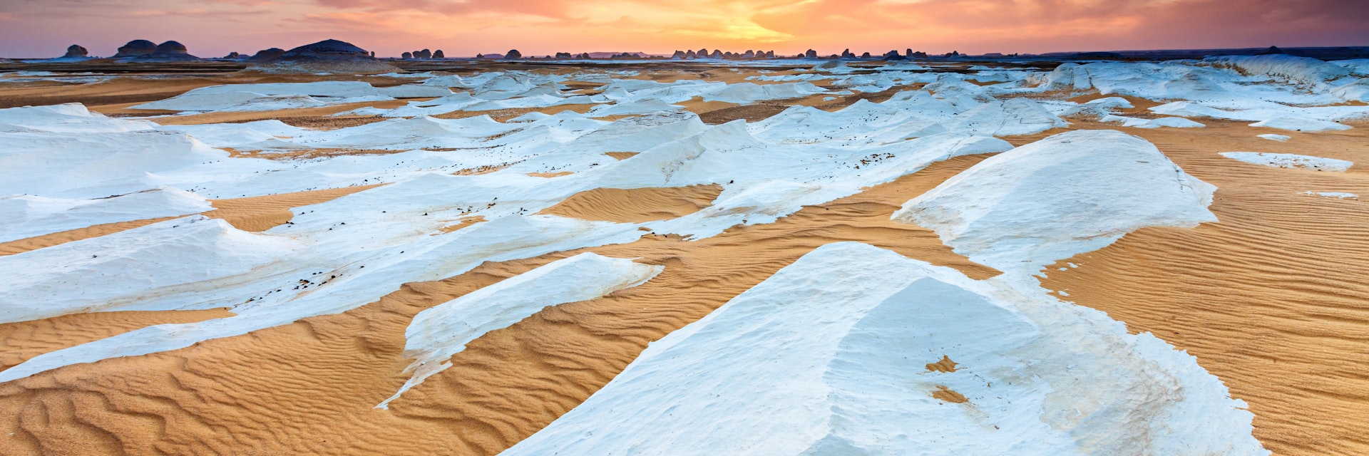 "Sunset over  The White Desert, part of The Western Sahara Desert in Egypt. The White Desert of Egypt is located 45 km (28 mi) north of the town of Farafra. The desert has a white, cream color and has massive chalk rock formations that have been created as a result of occasional sandstorm in the area."
175454221
"Horizon Over Land, Africa, Arid Climate, Awe, Beauty In Nature, Chalk, Cloud, Cloudscape, Desert, Dramatic Sky, Dry, Dusk, Egypt, Environment, Extreme Terrain, Geological Feature", Heat, Horizon, Idyllic, Land, Land Feature, Landscape, Landscapes, Large, Light, Majestic, Moody Sky, National Park, Natural Land State, Natural Phenomenon, Nature, Nature, Nature Reserve, Nobody, Non-Urban Scene, Parkland, Remote, Rippled, Rock, Romantic Sky, Sahara Desert, Sand, Sand Dune, Saturated Color, Scenics, Shade, Shadow, Sky, Solitude, Sun, Sunbeam, Sunlight, Sunset, Twilight, Vibrant Color, Western Sahara Desert, White Desert