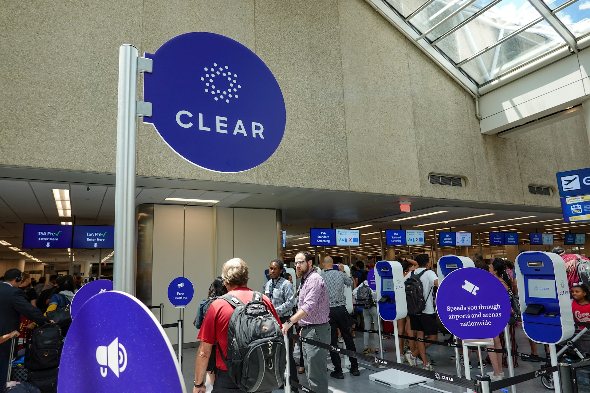 Airport security at a busy international airport with Clear