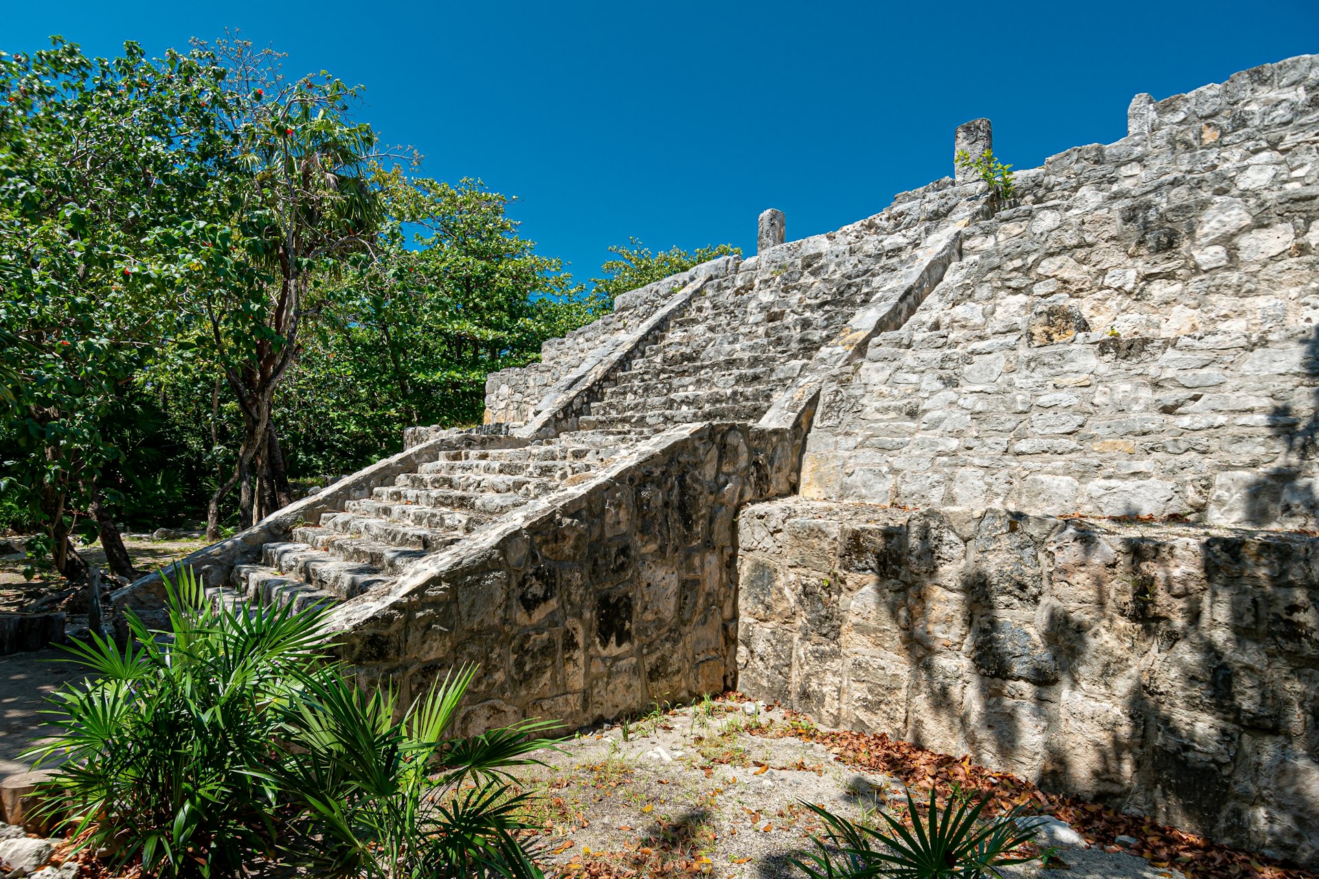 A view of a staircase leading up a Mayan pyramid ruin outside of Cancún