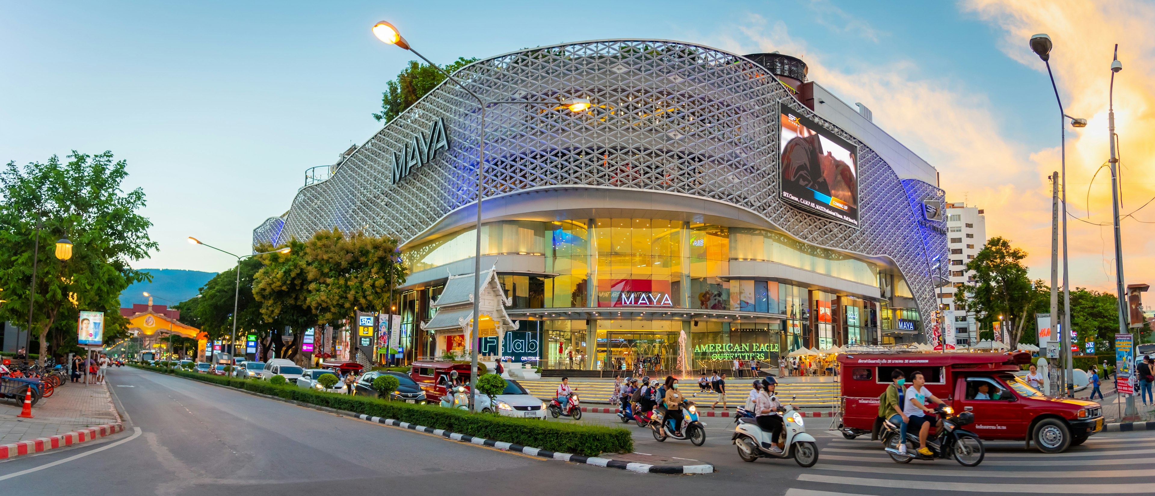 Unidentified people walk at landmark and the famous street of Chiang Mai City in front of MAYA shopping store