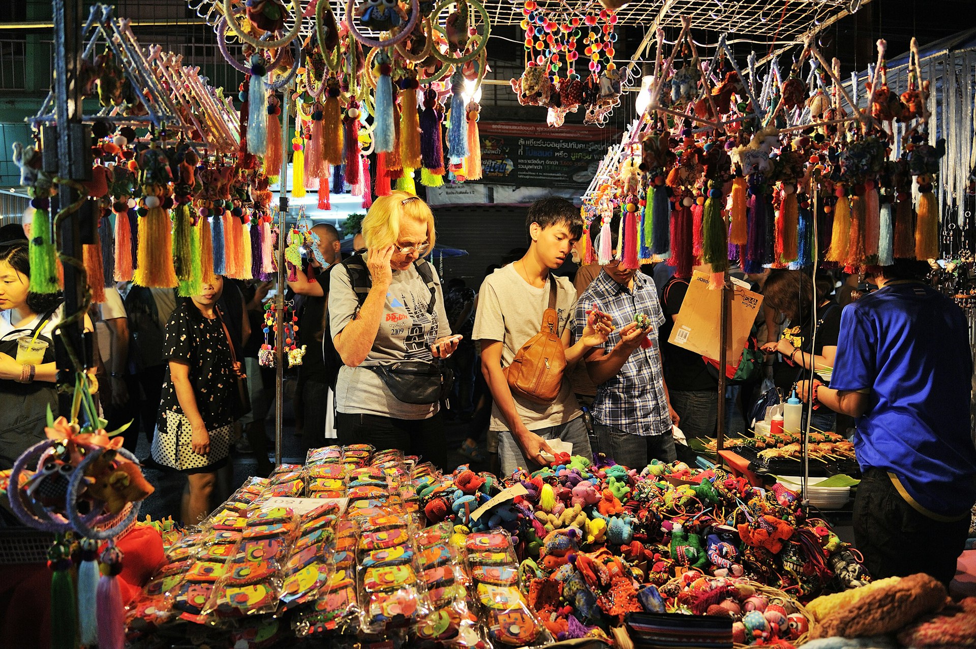Customers looking at goods, Saturday market walking Street, Chiang Mai
