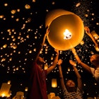 A Thai family release a sky lantern during Yi Peng Festival in Chiangmai.
270299633
thailand, fly, lamp, travel, balloon, culture, night, orange, celebration, light, people, traditional, asia, family, tourist, thai, flame, siam, lantern, hope, tradition, float, fire, festival, lucky, paper, sky, buddha, romantic, candle, hand, asian, happy, air, chiangmai, phuket, peng, krathong