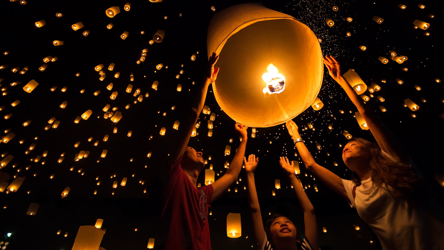 A Thai family release a sky lantern during Yi Peng Festival in Chiangmai.
270299633
thailand, fly, lamp, travel, balloon, culture, night, orange, celebration, light, people, traditional, asia, family, tourist, thai, flame, siam, lantern, hope, tradition, float, fire, festival, lucky, paper, sky, buddha, romantic, candle, hand, asian, happy, air, chiangmai, phuket, peng, krathong