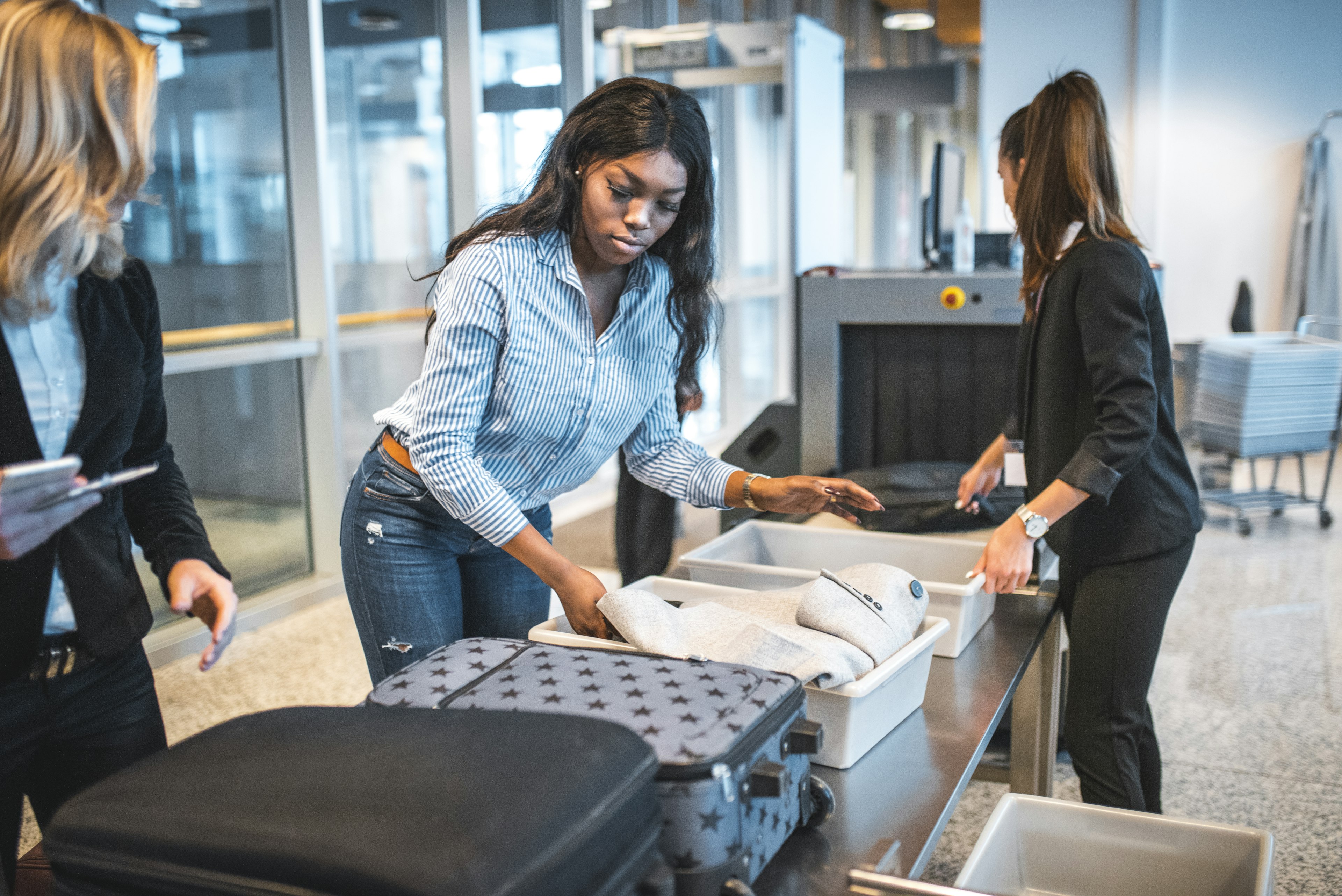 Female passengers going through security checks