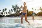 Happy Adult Woman Running into the Sea on Tropical Vacations.
1097136152