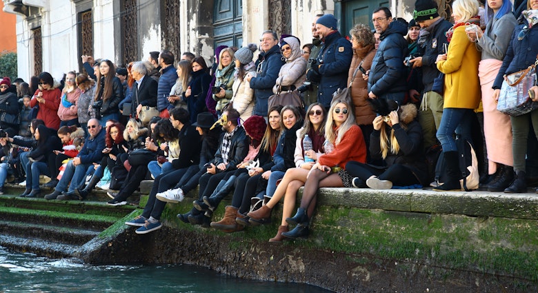 People watch the the traditional regatta for the opening of the 2019 Venice Carnival on February 17, 2019 in Venice, Italy. The theme for the 2019 edition of Venice Carnival is 'Blame the Moon!' and will run from the 16th of February to 5th of March 2019  (Photo by Matteo Chinellato/NurPhoto via Getty Images)
1125751716
Venica Carnival, Venice, Opening Event, Italian Culture, Italy, Arts Culture and Entertainment, Venice - Italy, February 17, 2019, 17th February 2019, People, Parade, Traditional Parade, Blame of The Moon, Parade Vencie Carnival Venice, Mask, Masked People, Traditional, Crowd, Waterway, Water, Team, Fun, Tourism, Event, Recreation, Leisure, Vehicle, person, outdoor, people, group, edition of Venice Carnival, opening, Matteo Chinellato, NurPhoto, traditional regatta, theme, Moon, Human Interest, Venice