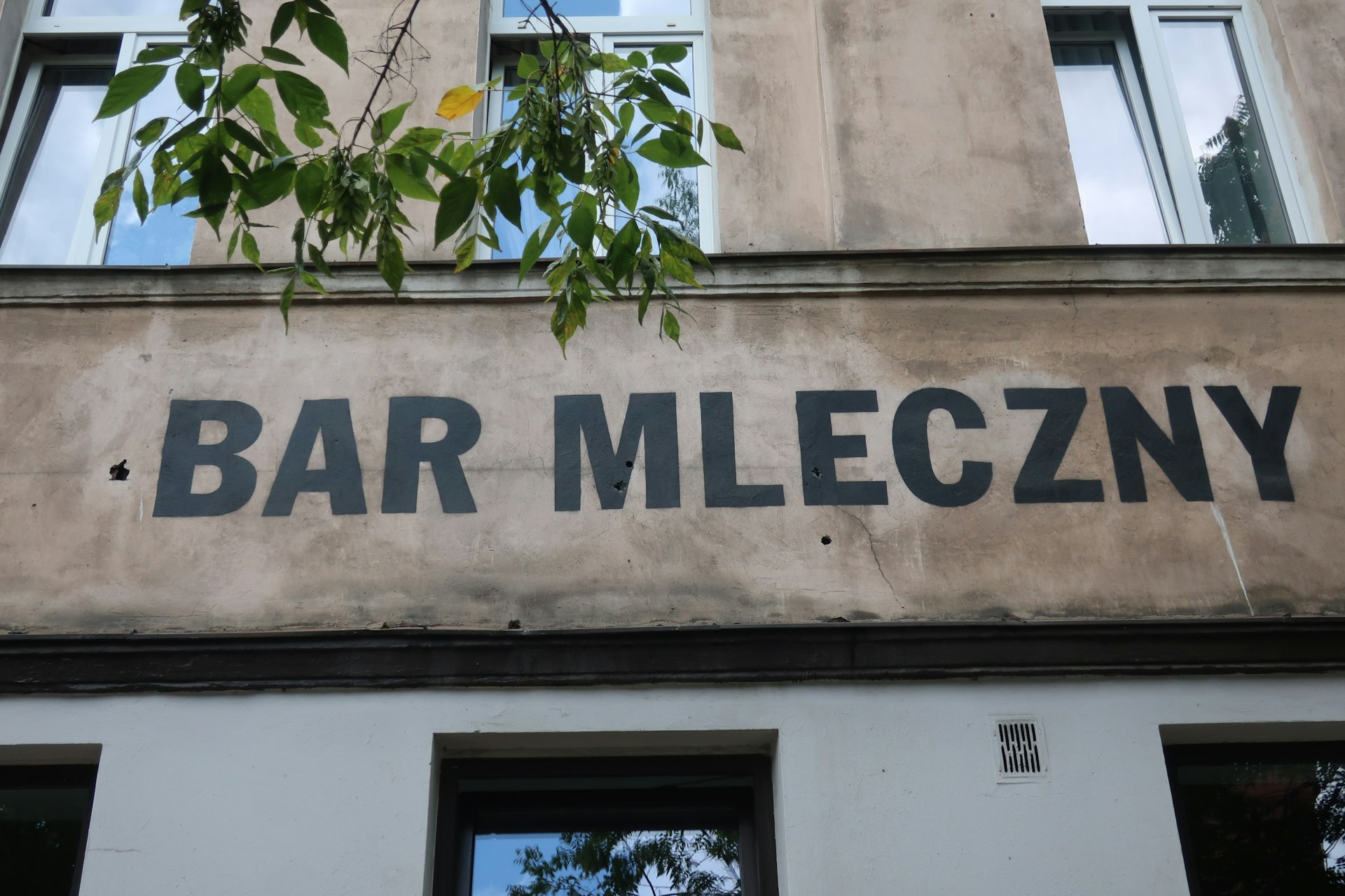 The lettering of a bar mleczny in Kraków on the side of the restaurant