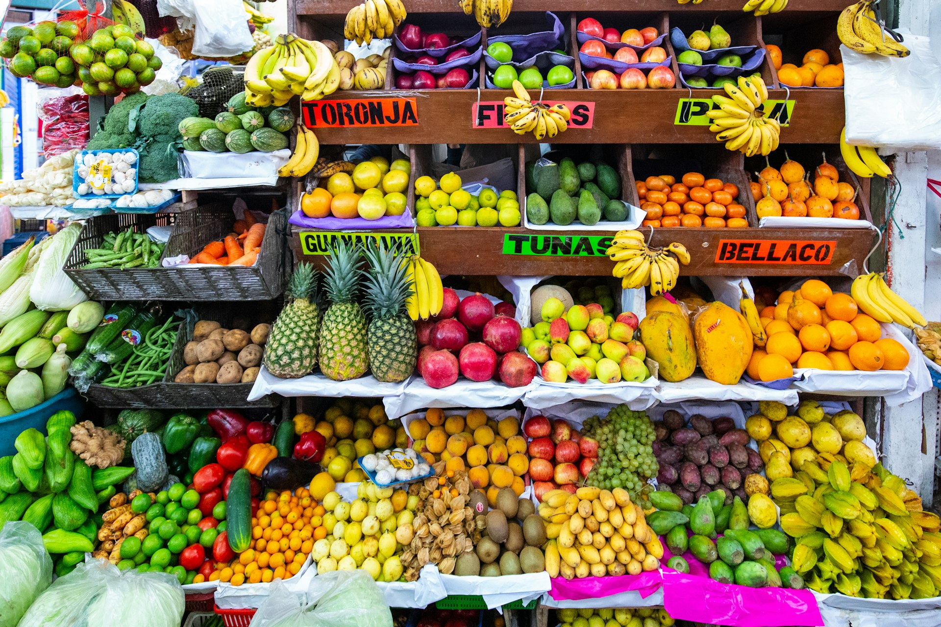 A colorful fruit and vegetable stand in Surquillo Market, Lima, Peru